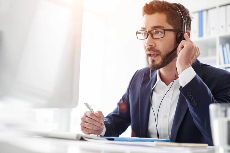 man listening closely to customer issues
