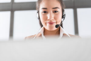 Portrait,Of,Happy,Smiling,Female,Customer,Support,Phone,Operator,At