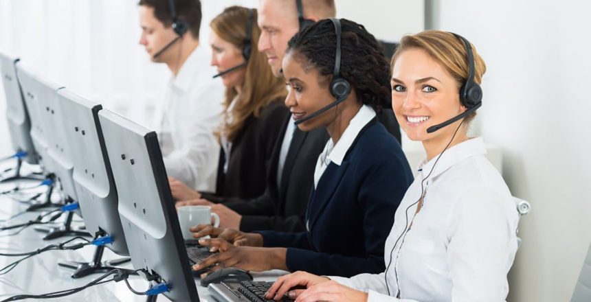 Call center employees typing and working at their computers