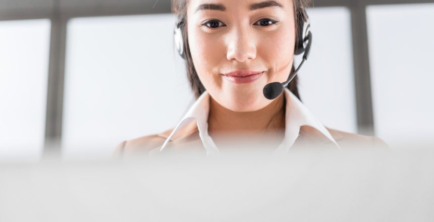 Portrait,Of,Happy,Smiling,Female,Customer,Support,Phone,Operator,At